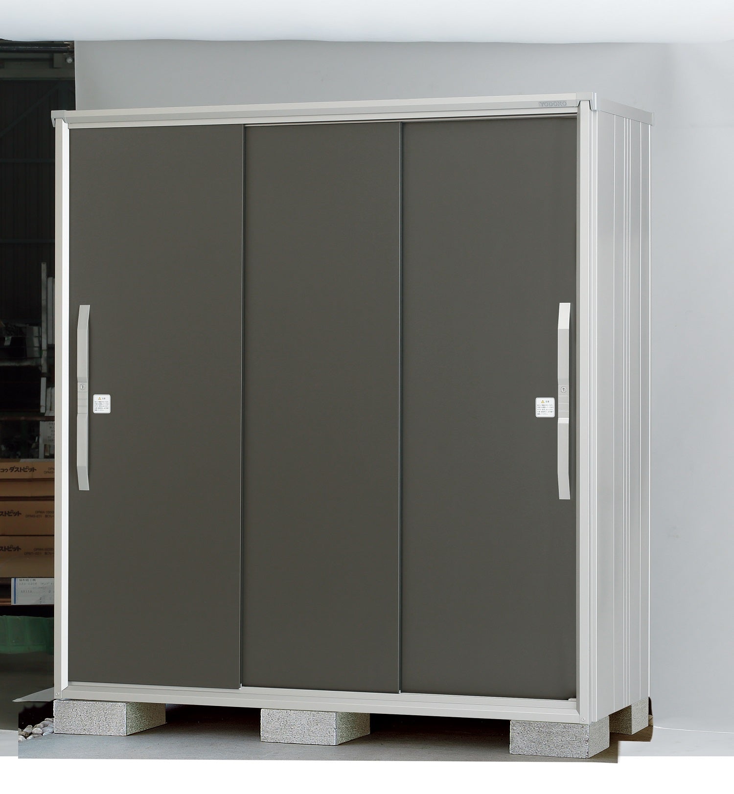 Yodoko Premium Shed for storage, made in Japan, featuring a sleek design with three doors and durable construction.