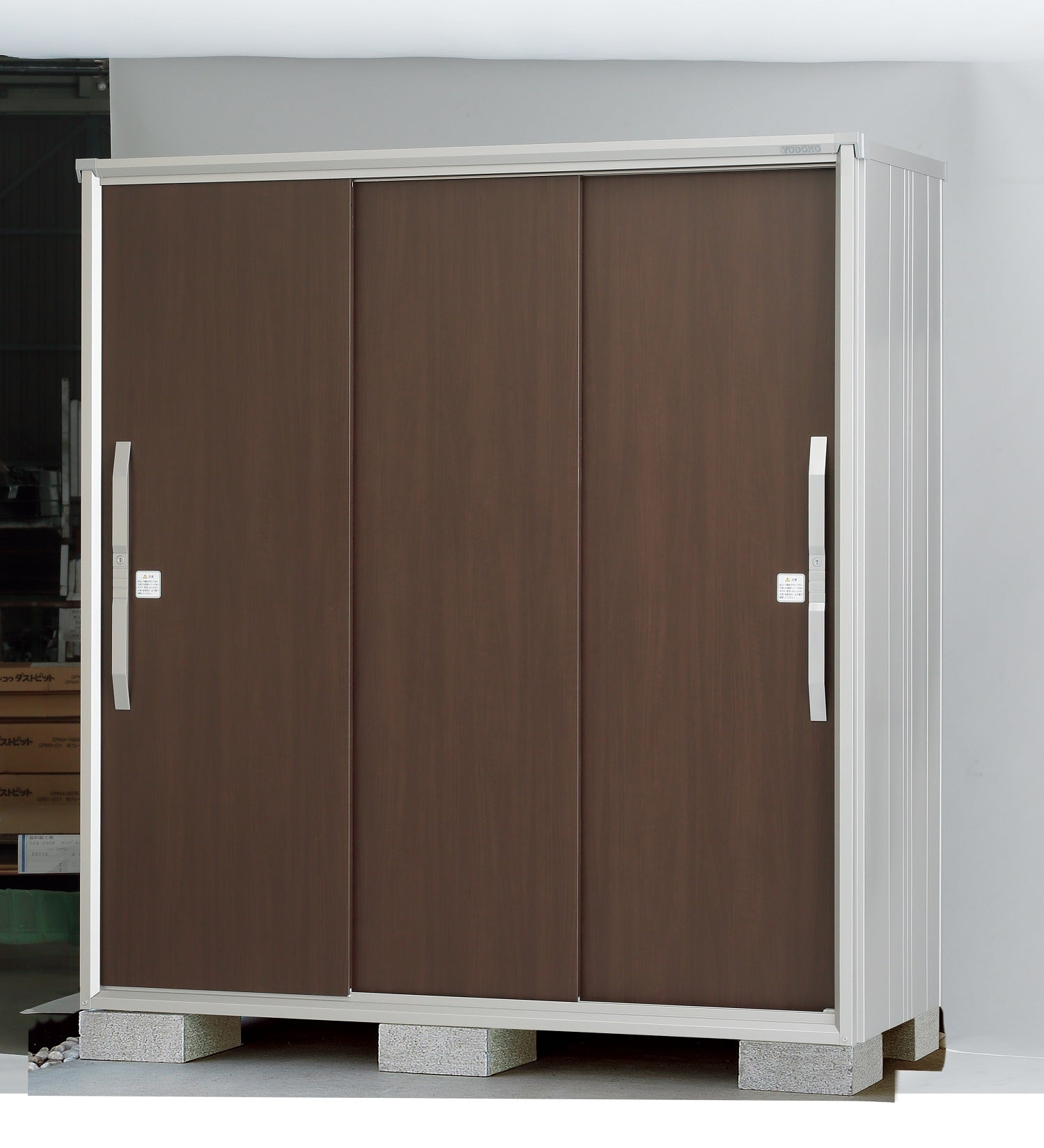 Yodoko Premium Shed, made in Japan, featuring a modern design with three sliding doors for efficient storage.