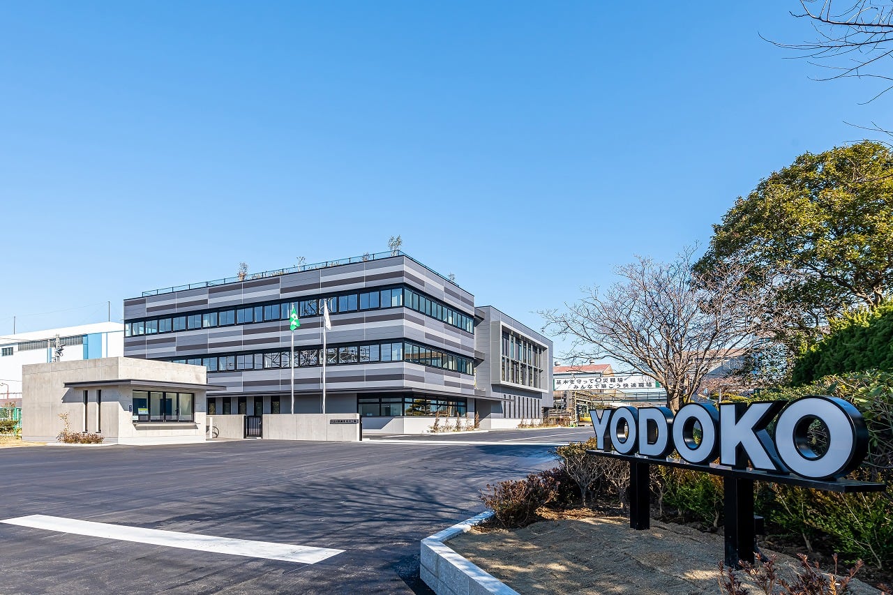 Outside view of Yodoko building with a sign saying YODOKO